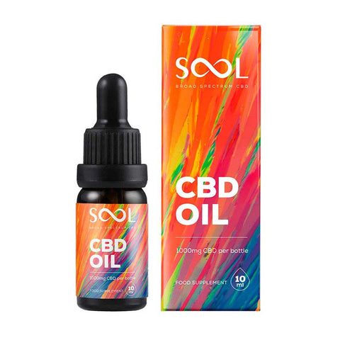 CBD oil bottle and packaging with colorful design on a white background